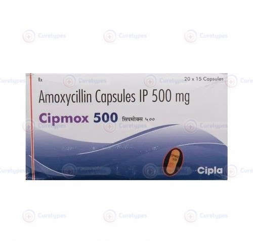 Augmentin tablet containing Amoxicillin and Clavulanic acid for treating bacterial infections.