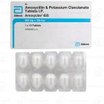 Augmentin tablet containing Amoxicillin and Clavulanic acid for treating bacterial infections.
